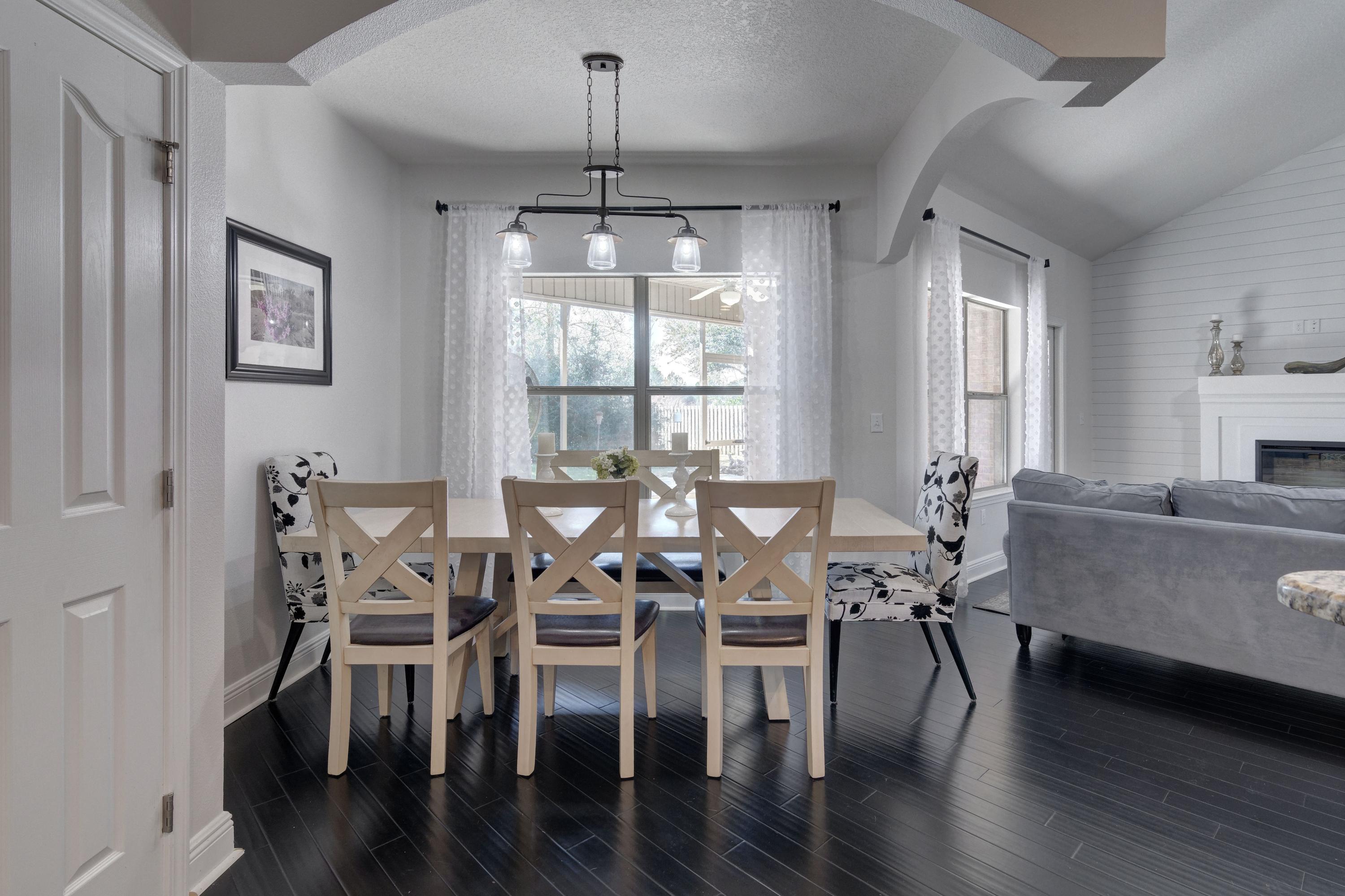 52 Mango Lane Freeport, FL 32439 - Photo 16 of 69 a view of a dining room with furniture window and wooden floor