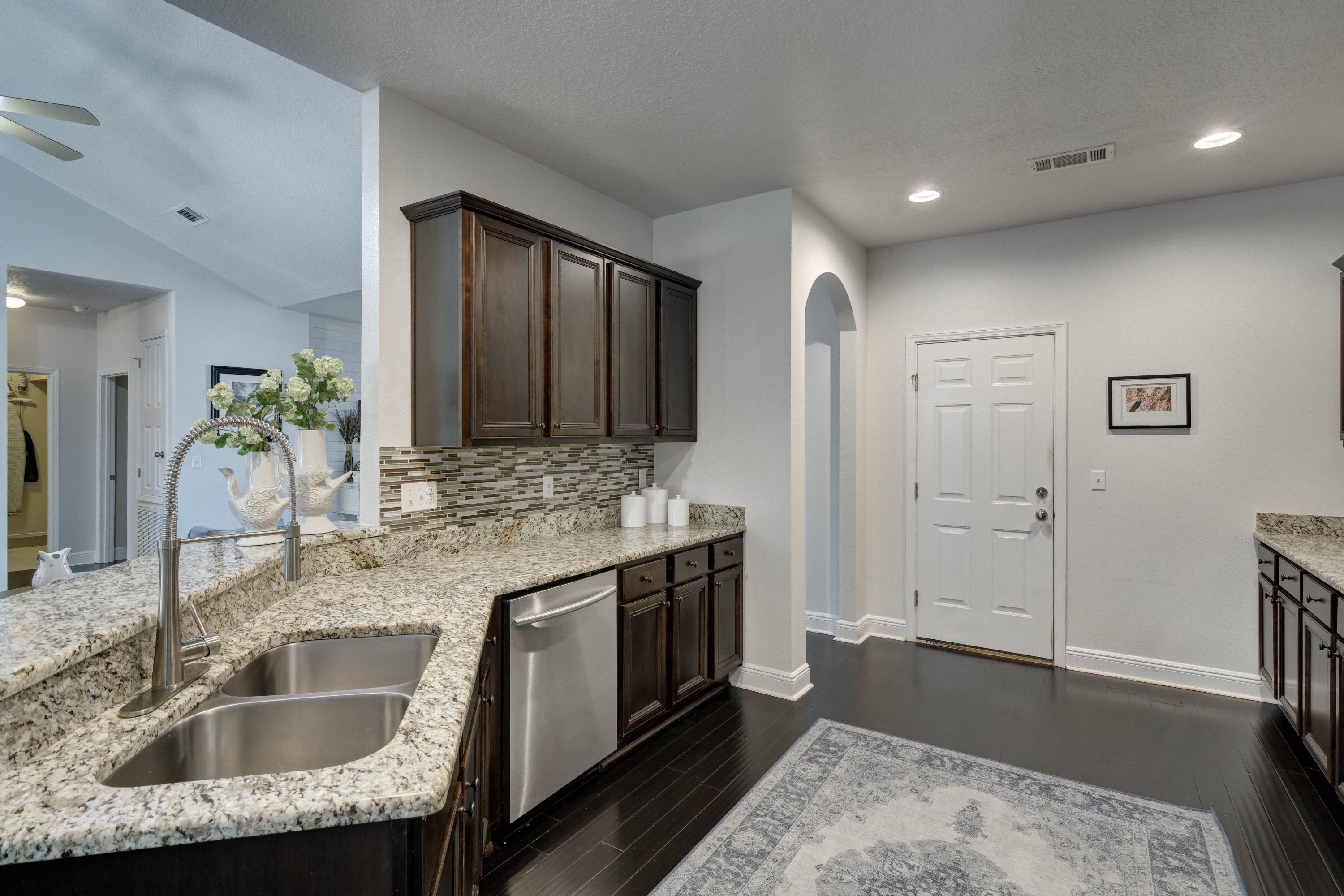 52 Mango Lane Freeport, FL 32439 - Photo 20 of 69 a bathroom with a granite countertop sink and a mirror