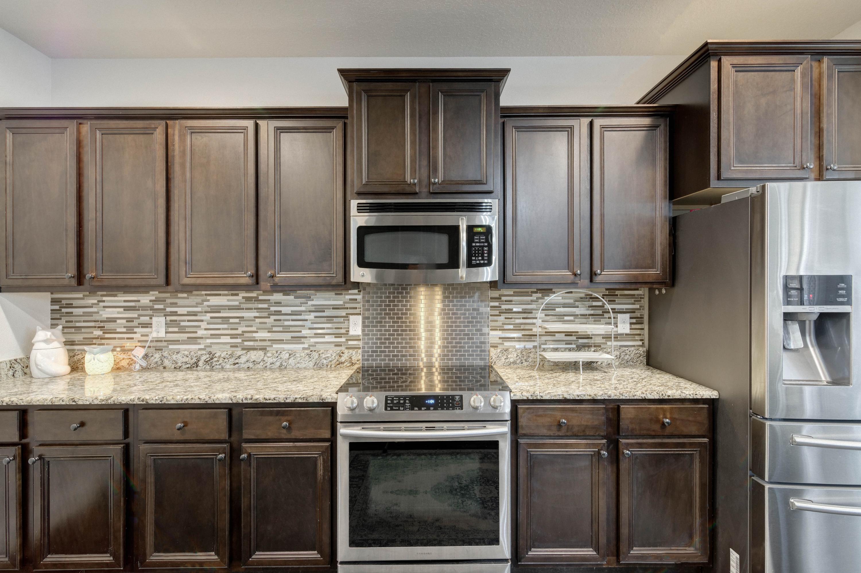 52 Mango Lane Freeport, FL 32439 - Photo 23 of 69 a kitchen with stainless steel appliances granite countertop a refrigerator stove and sink