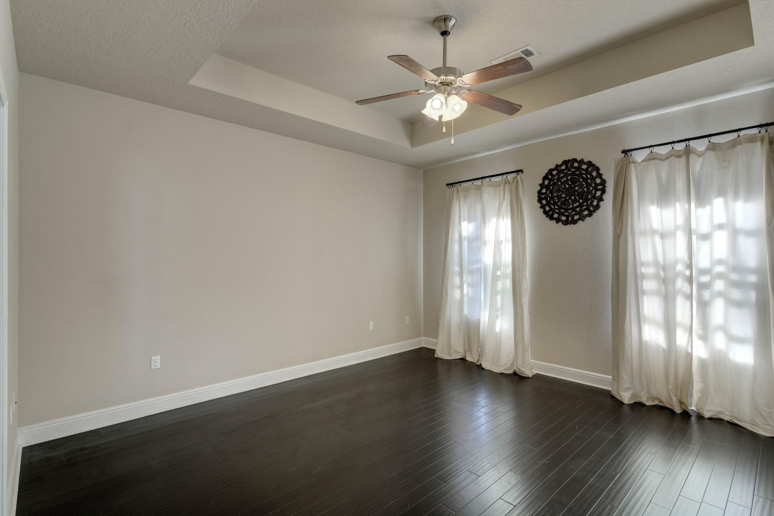 52 Mango Lane Freeport, FL 32439 - Photo 24 of 69 an empty room with wooden floor and windows