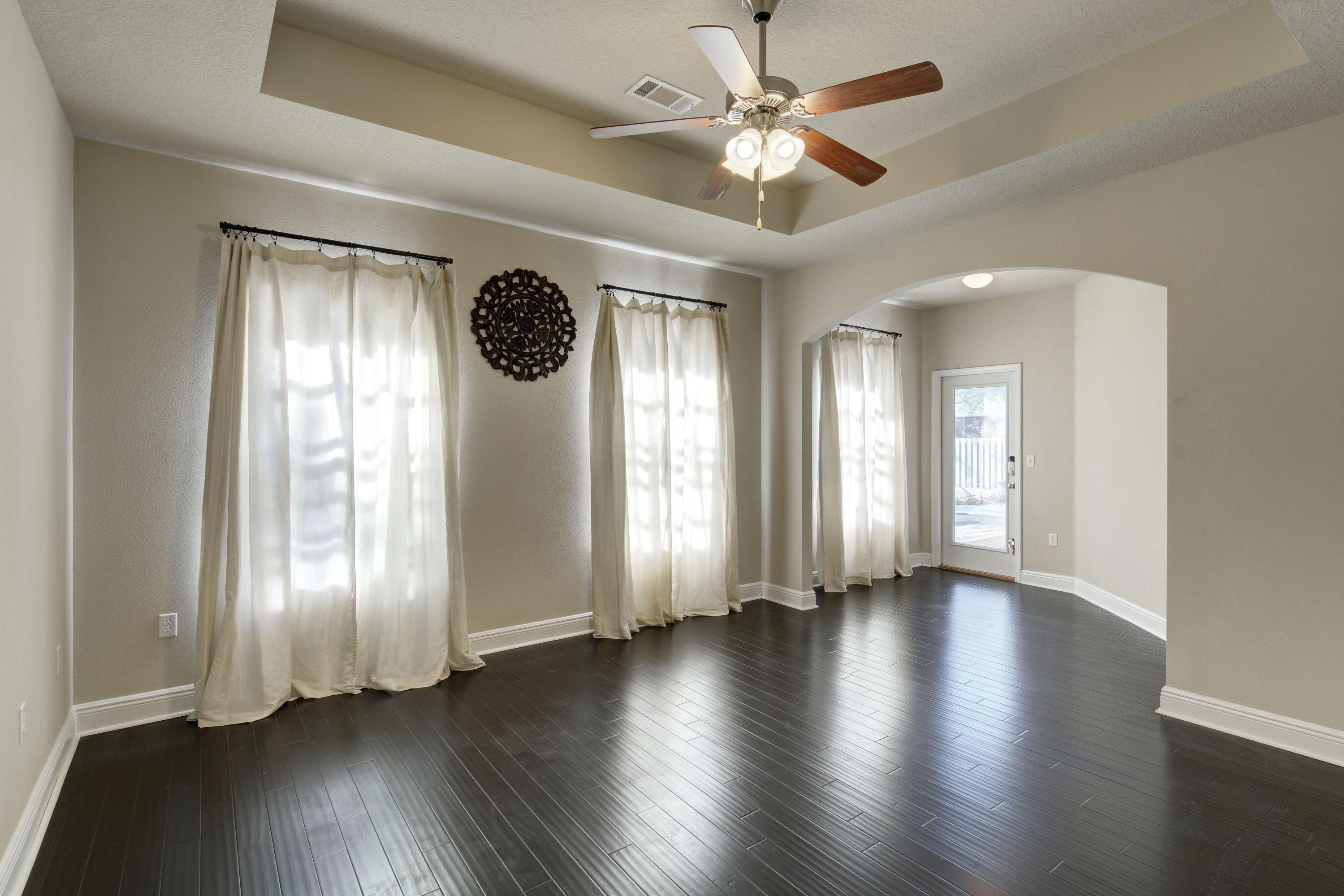 52 Mango Lane Freeport, FL 32439 - Photo 28 of 69 an empty room with wooden floor and windows