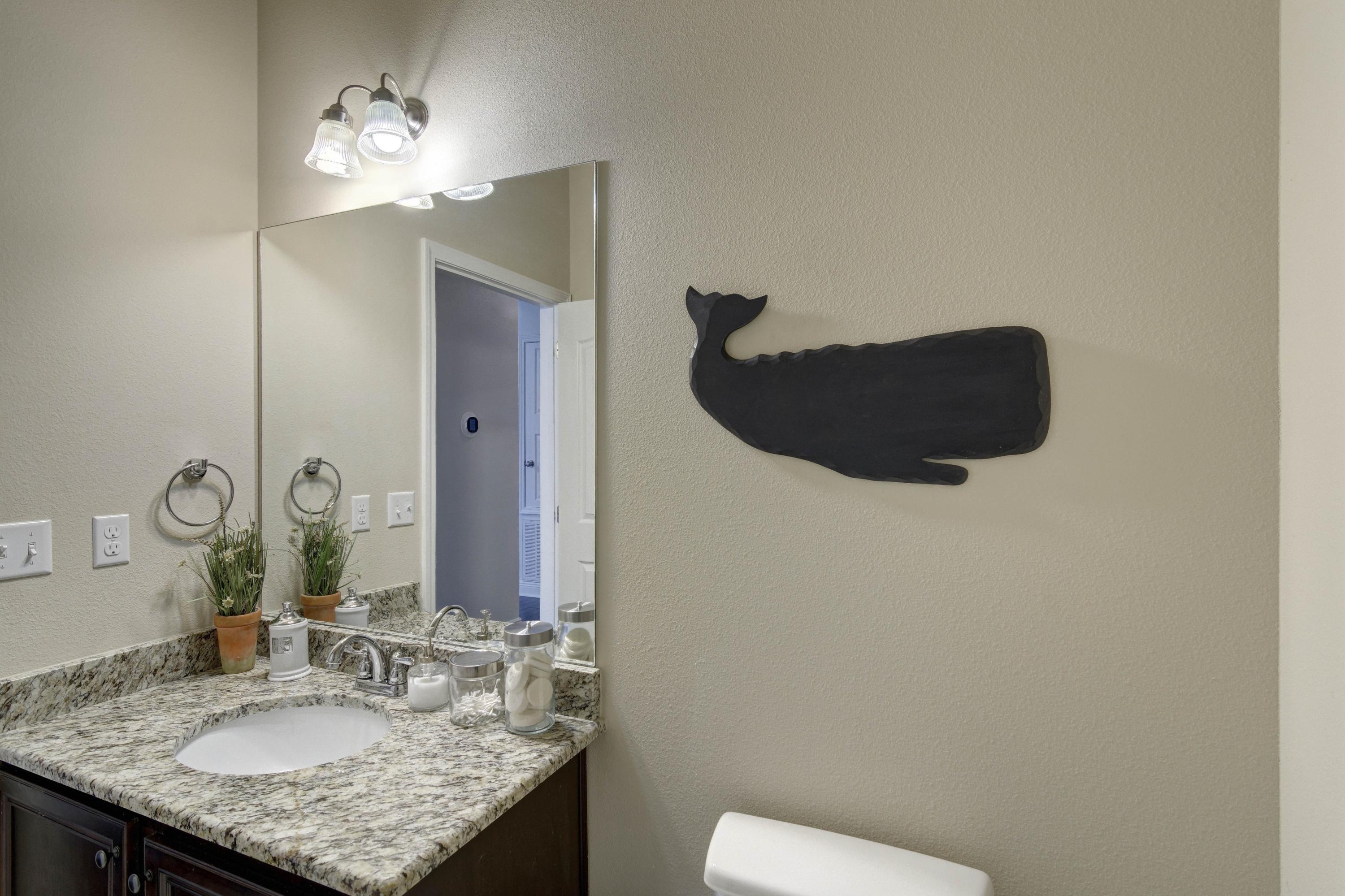 52 Mango Lane Freeport, FL 32439 - Photo 37 of 69 a bathroom with a granite countertop sink and a mirror