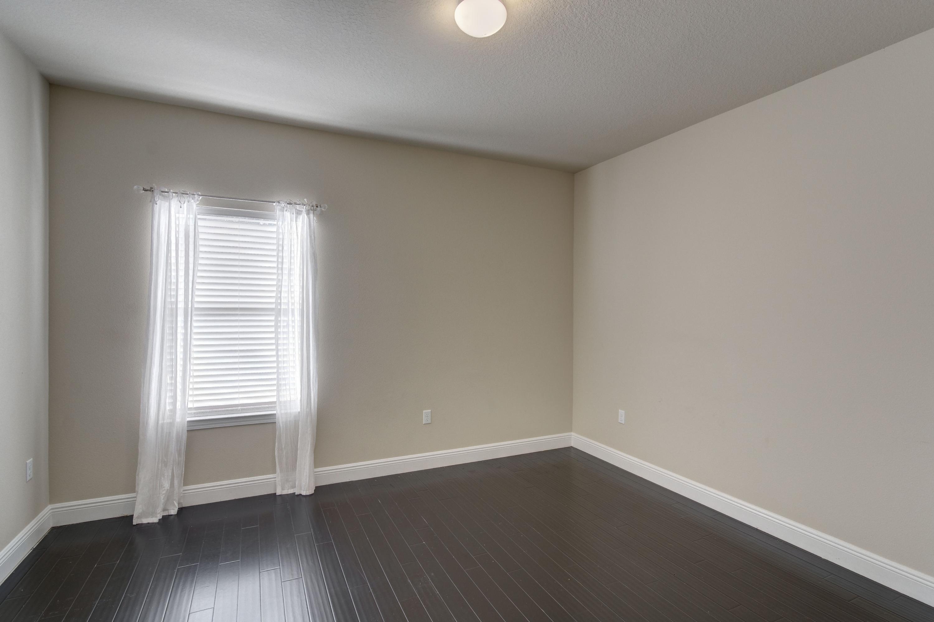 52 Mango Lane Freeport, FL 32439 - Photo 38 of 69 an empty room with wooden floor and a window