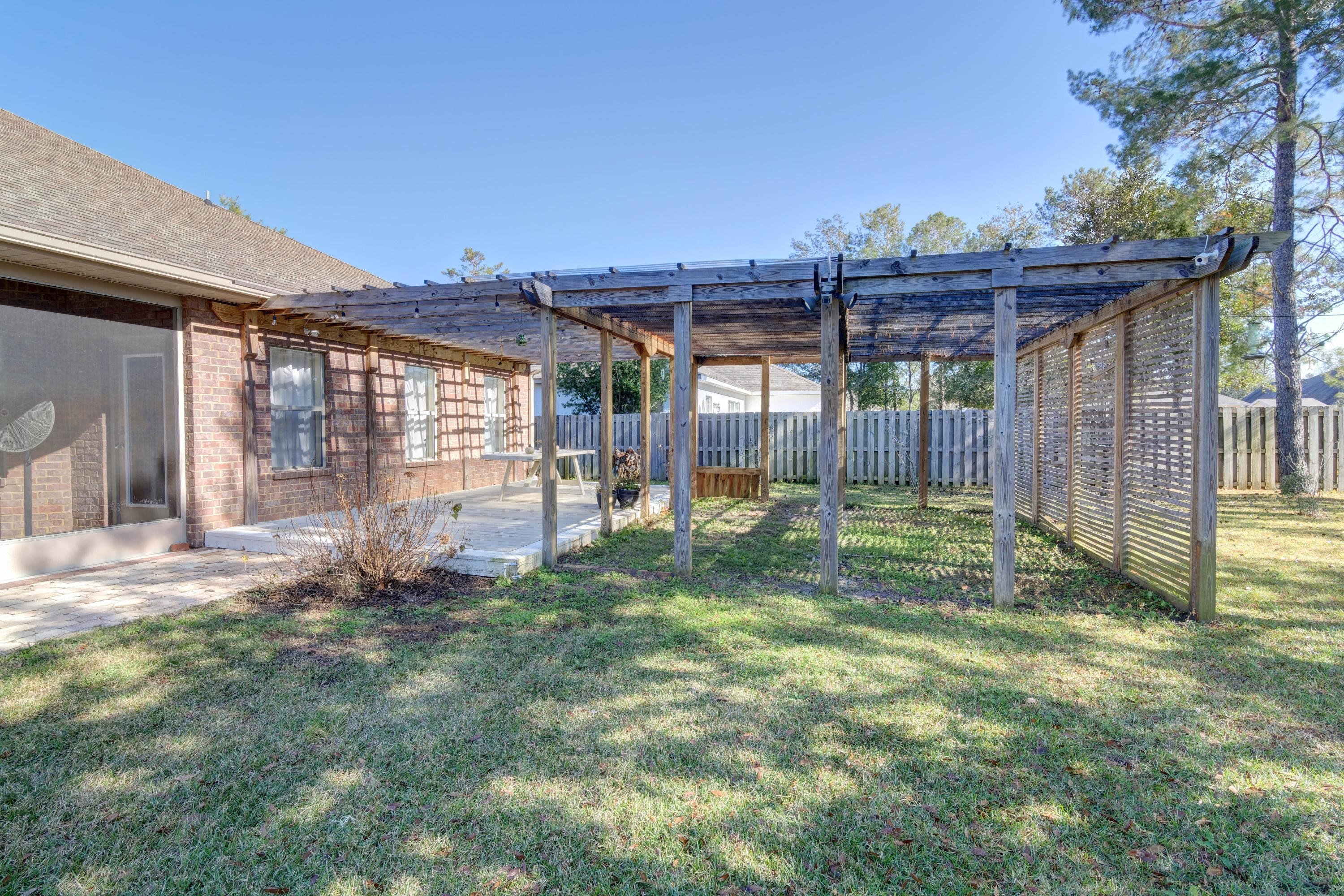 52 Mango Lane Freeport, FL 32439 - Photo 43 of 69 a view of a backyard with a garden and plants
