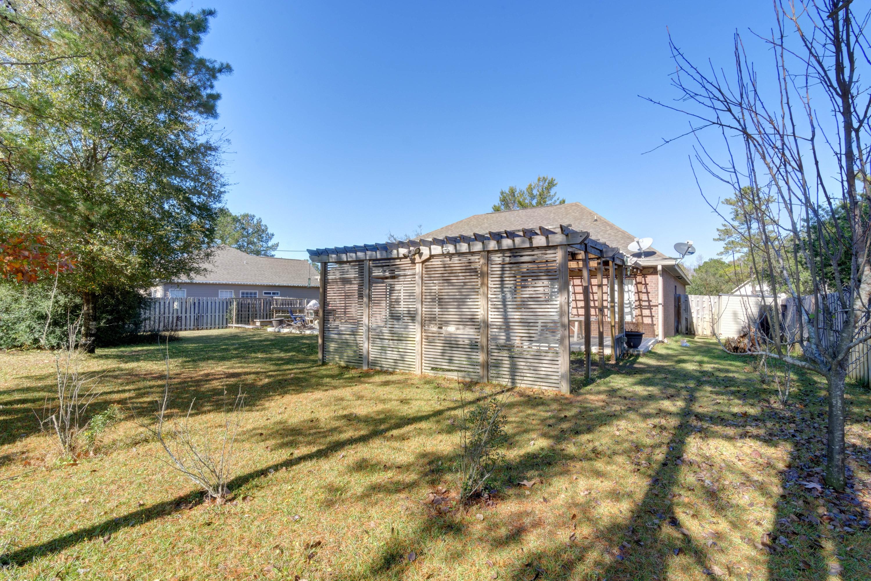 52 Mango Lane Freeport, FL 32439 - Photo 47 of 69 a view of a building with a yard