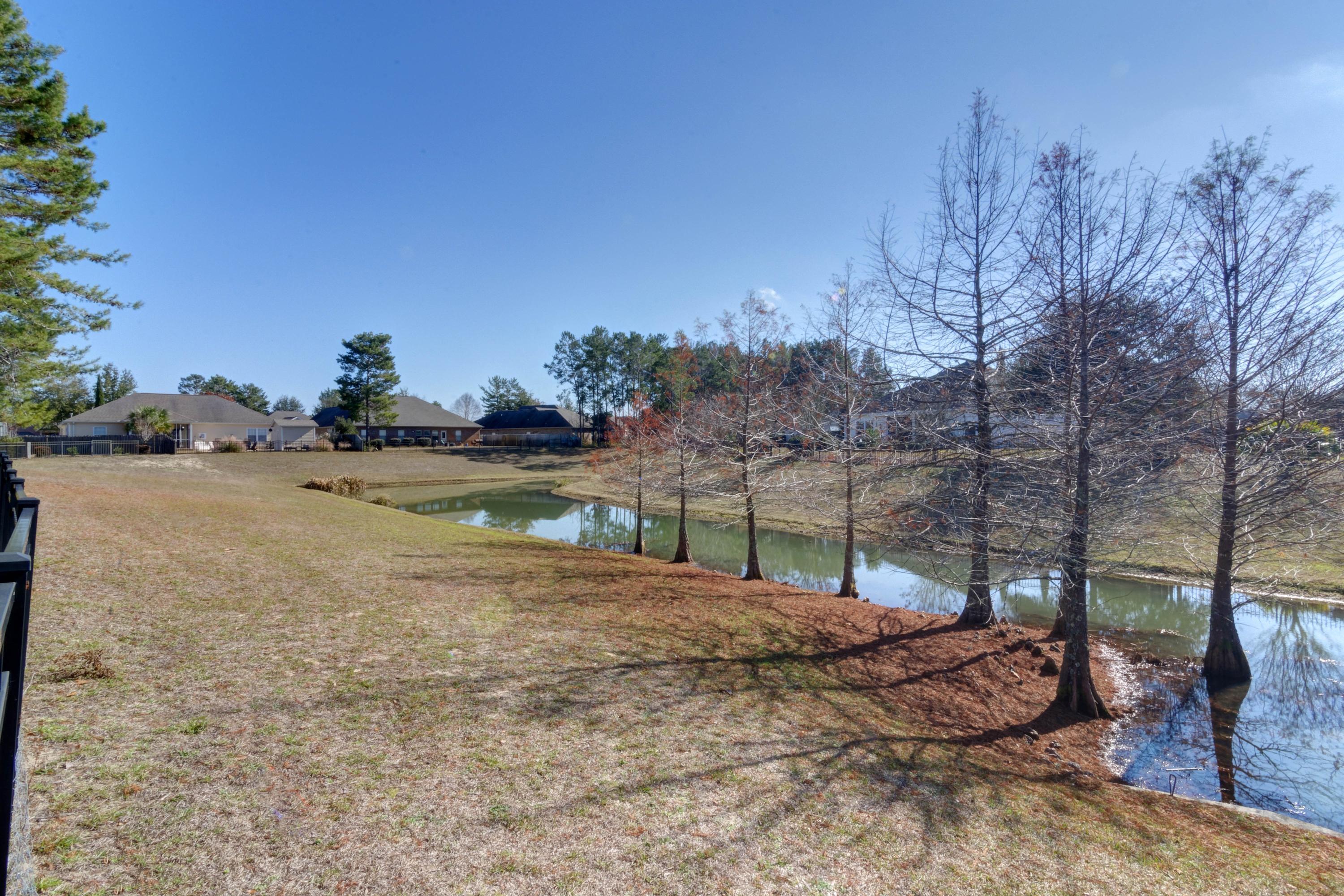 52 Mango Lane Freeport, FL 32439 - Photo 52 of 69 a backyard of a house with lots of green space