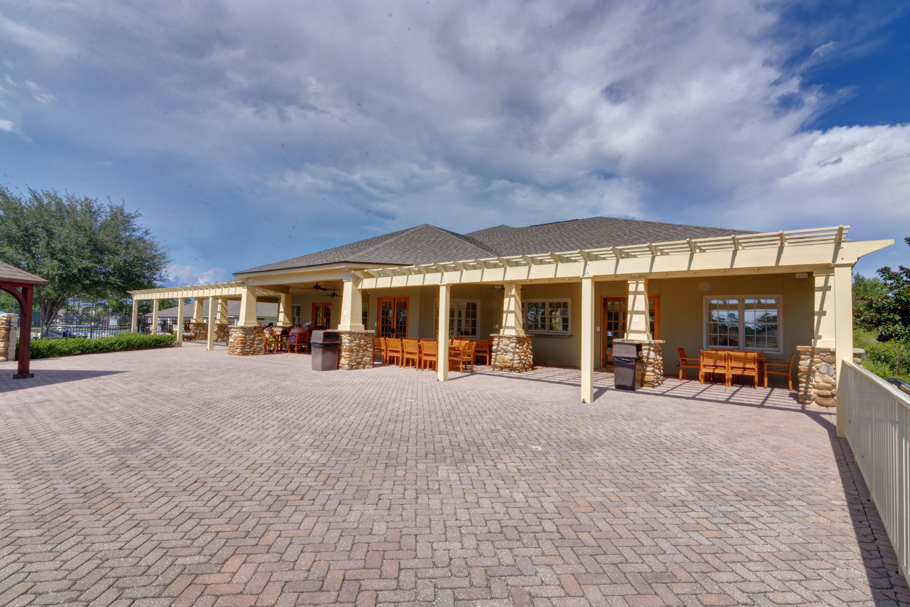 52 Mango Lane Freeport, FL 32439 - Photo 66 of 69 a view of a house with sitting area and garden