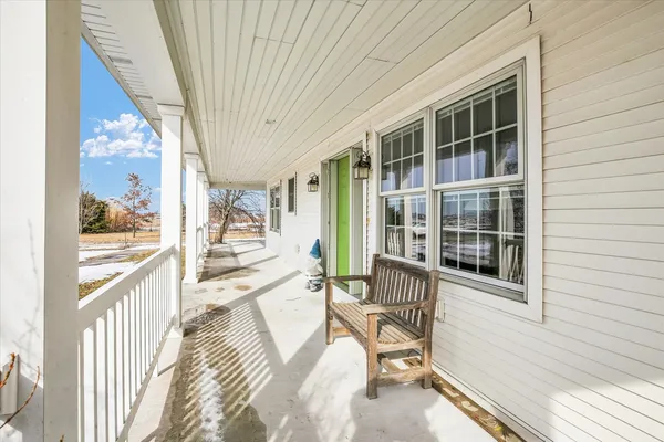 a view of a house with outdoor seating
