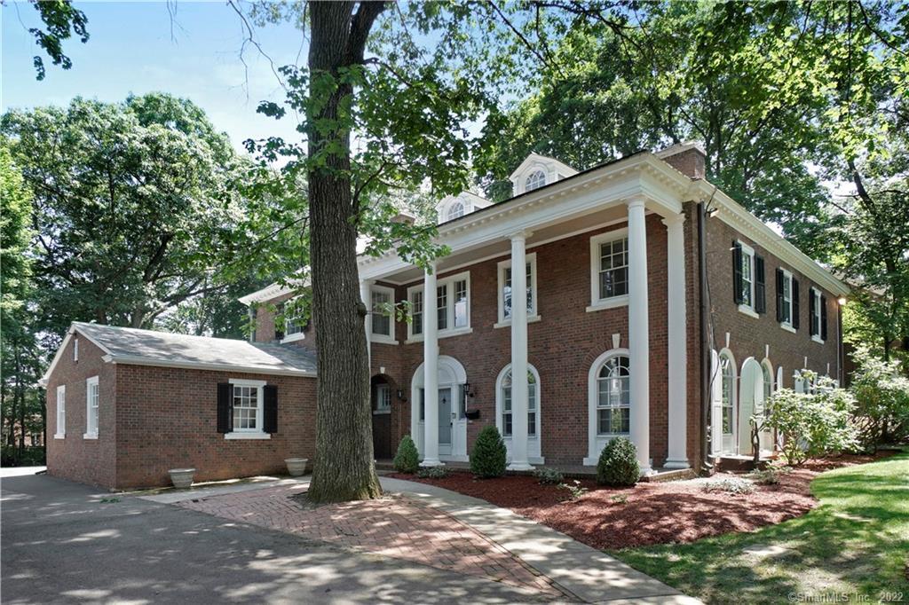 a front view of a house with yard