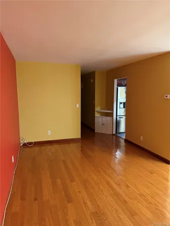 a view of an empty room and a window