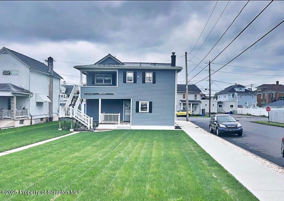 202 Barber Street, Unit 1 Old Forge, PA 18518 - Photo 2 of 9 a view of a yard in front of the house