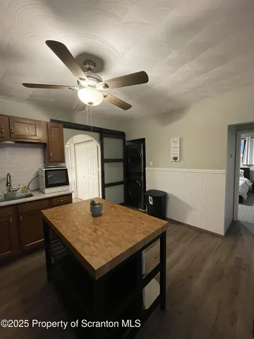 a view of kitchen island with wooden floor