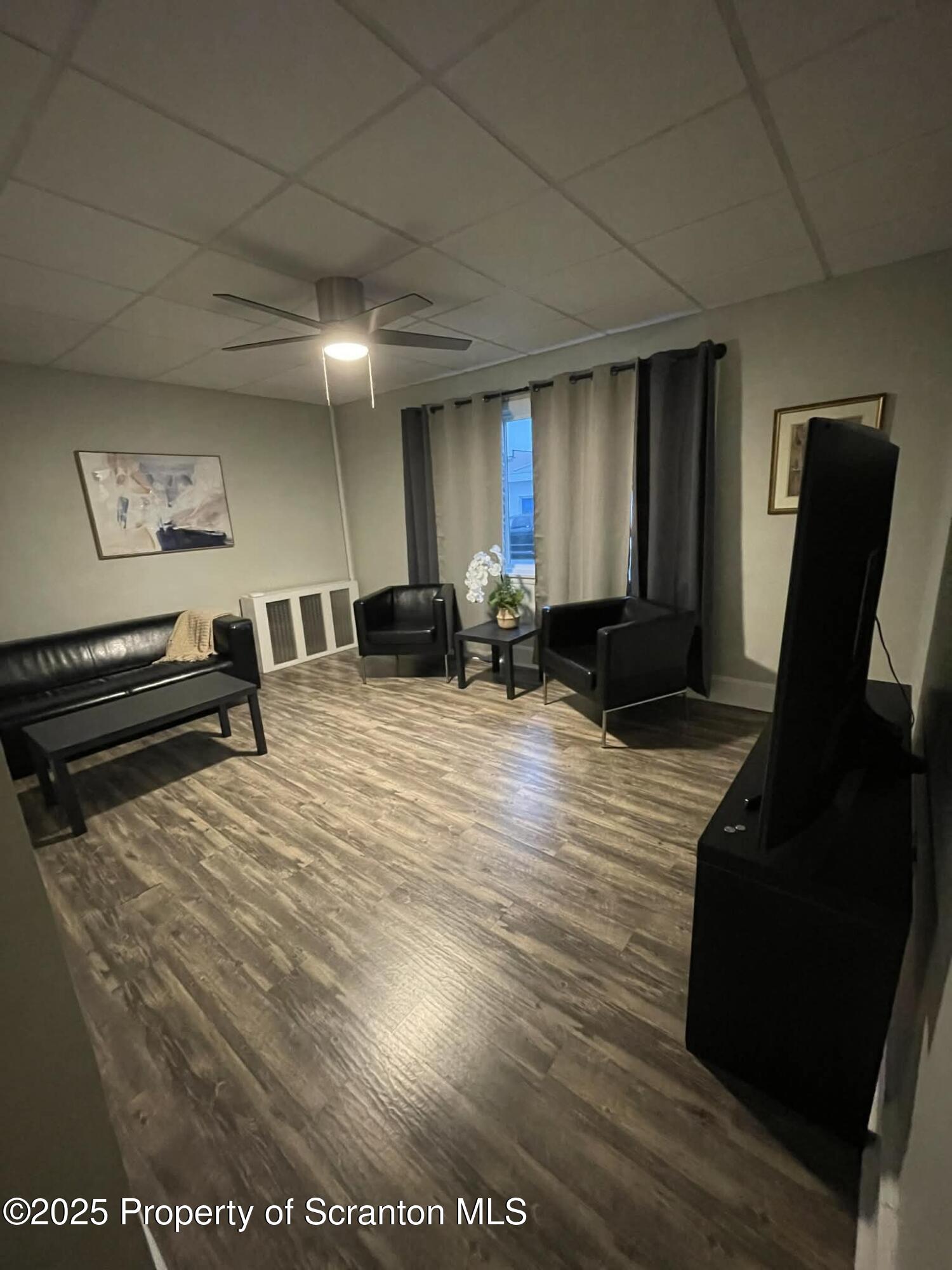 202 Barber Street, Unit 1 Old Forge, PA 18518 - Photo 8 of 9 a view of kitchen with furniture and wooden floor