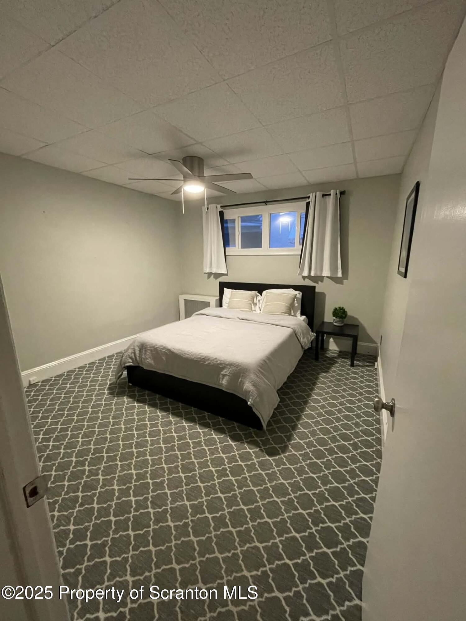 202 Barber Street, Unit 1 Old Forge, PA 18518 - Photo 9 of 9 a bedroom with a bed and a shower