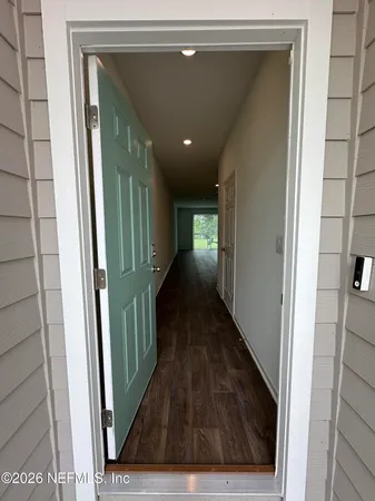a kitchen with refrigerator and cabinets