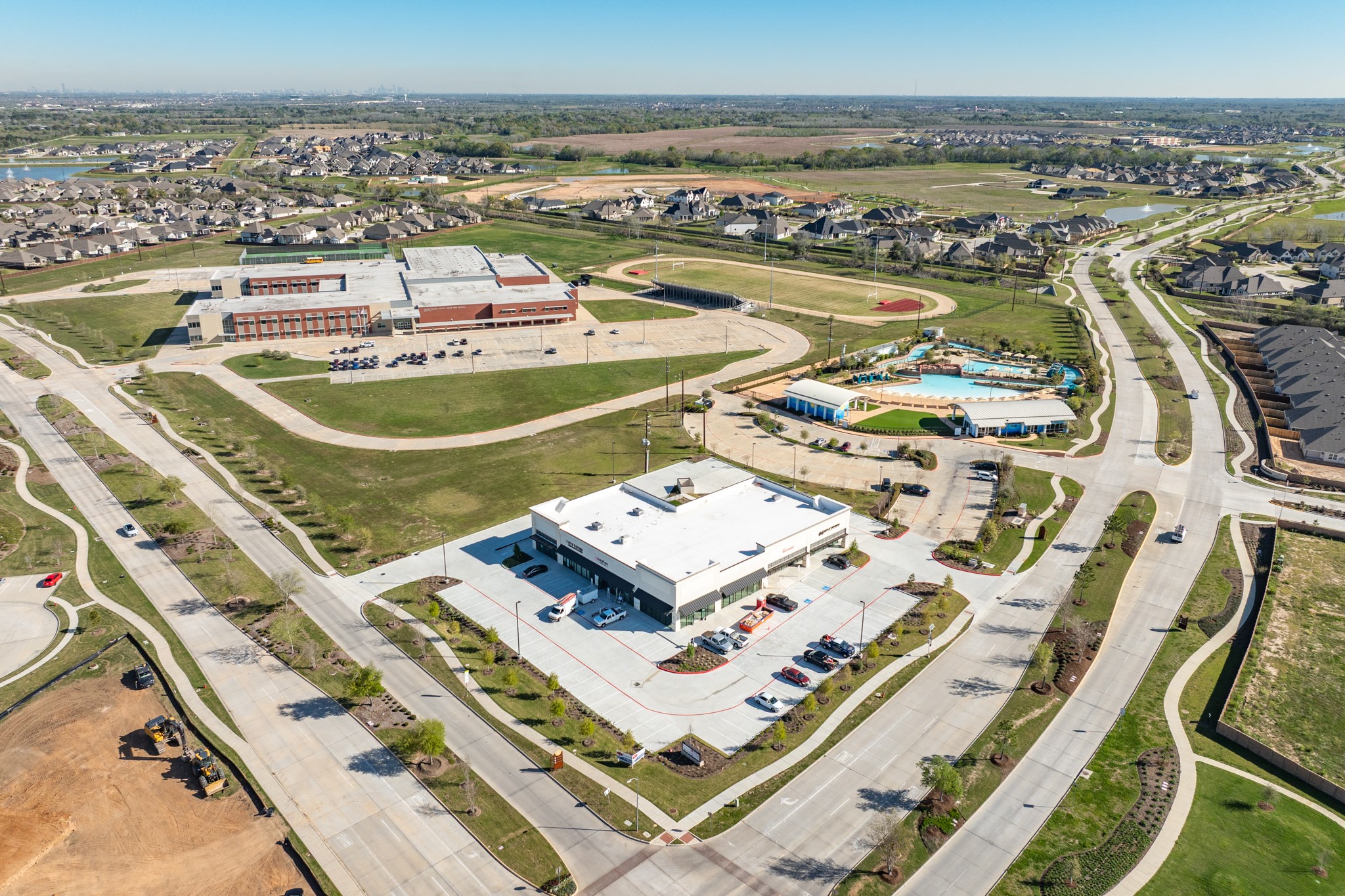 10002 Nectar Path Rosharon, TX 77583 - Photo 32 of 46 This aerial view includes the convenience store, Adventure Cove, and Caffey Middle School.