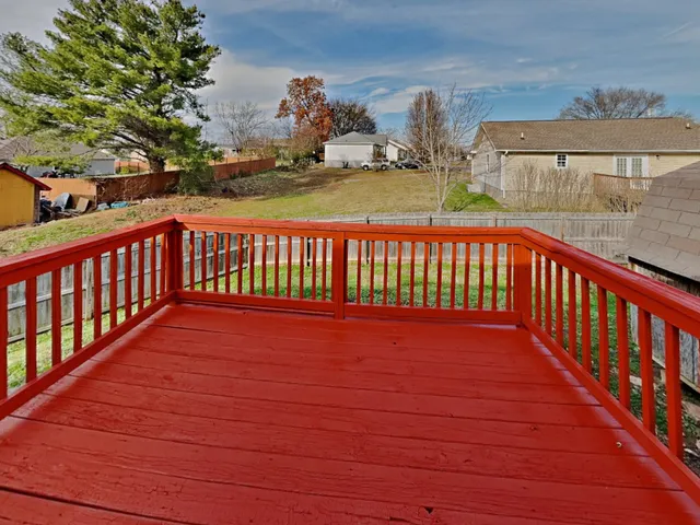 a view of a balcony with wooden floor