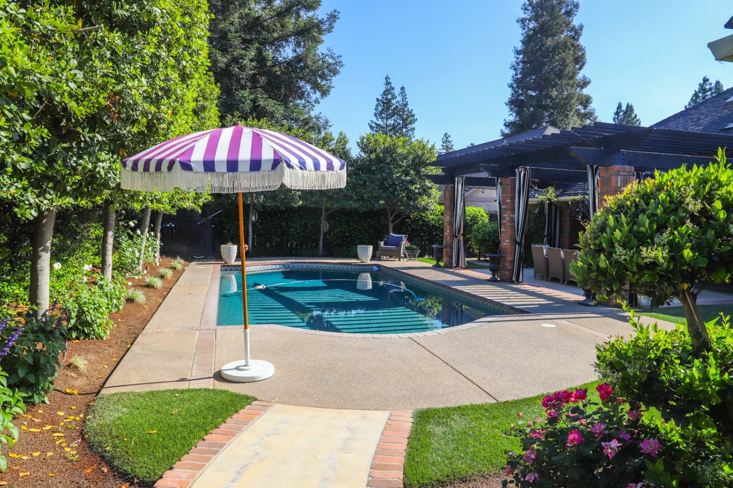 7322 North Geraldine Avenue Fresno, CA 93711 - Photo 11 of 36 a view of a backyard with a patio