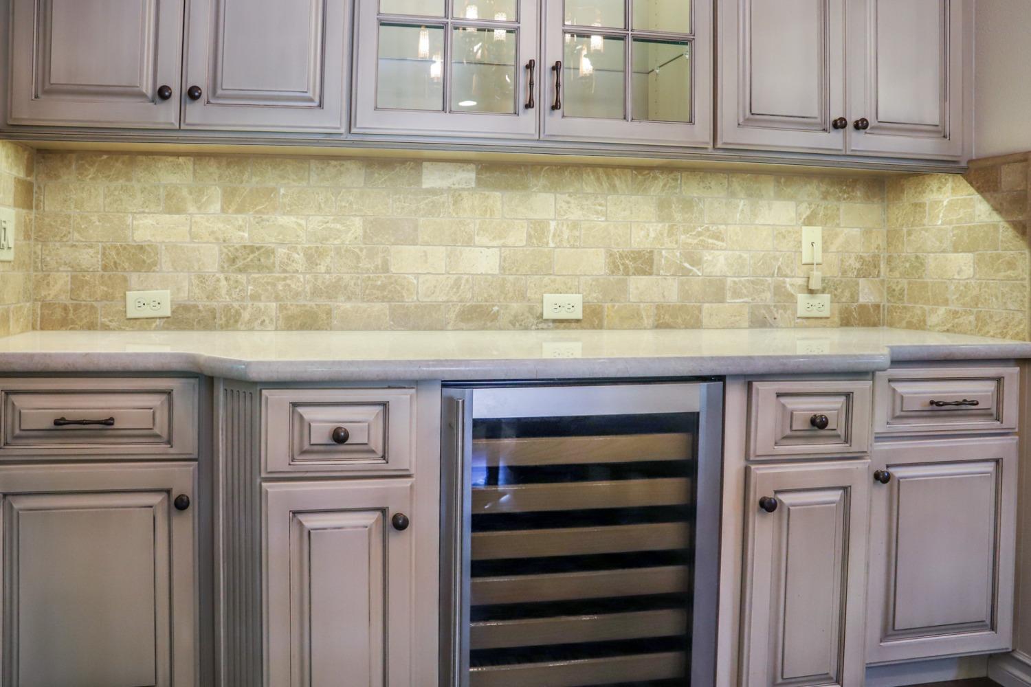 7322 North Geraldine Avenue Fresno, CA 93711 - Photo 20 of 36 a kitchen with granite countertop white cabinets and sink