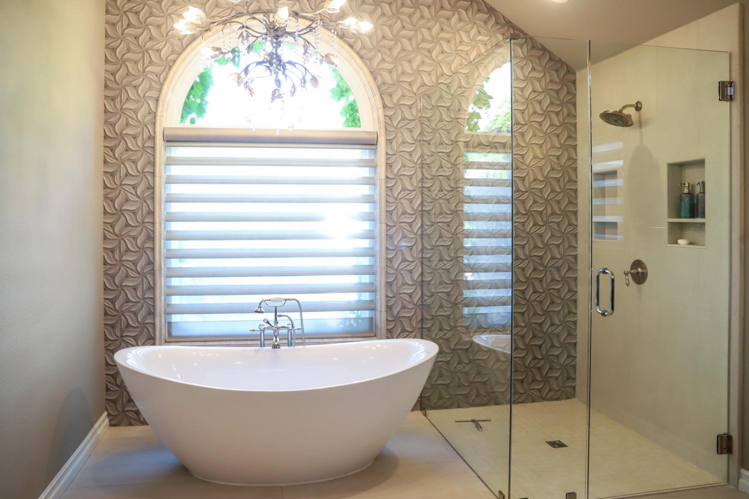 7322 North Geraldine Avenue Fresno, CA 93711 - Photo 22 of 36 a view of a bathtub in a bathroom