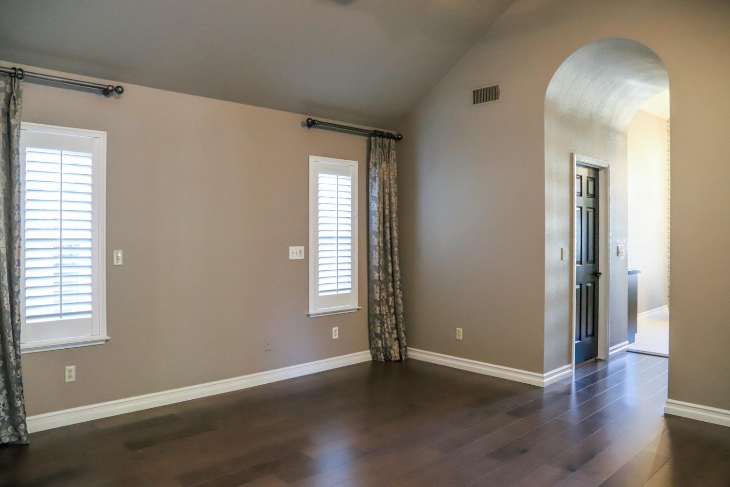 7322 North Geraldine Avenue Fresno, CA 93711 - Photo 25 of 36 an empty room with wooden floor and windows