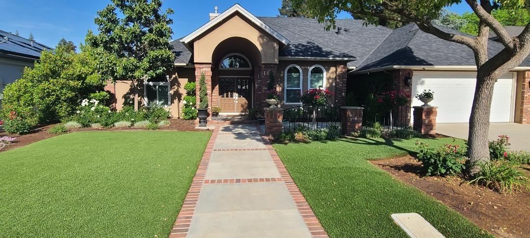 7322 North Geraldine Avenue Fresno, CA 93711 - Photo 36 of 36 a front view of a house with garden