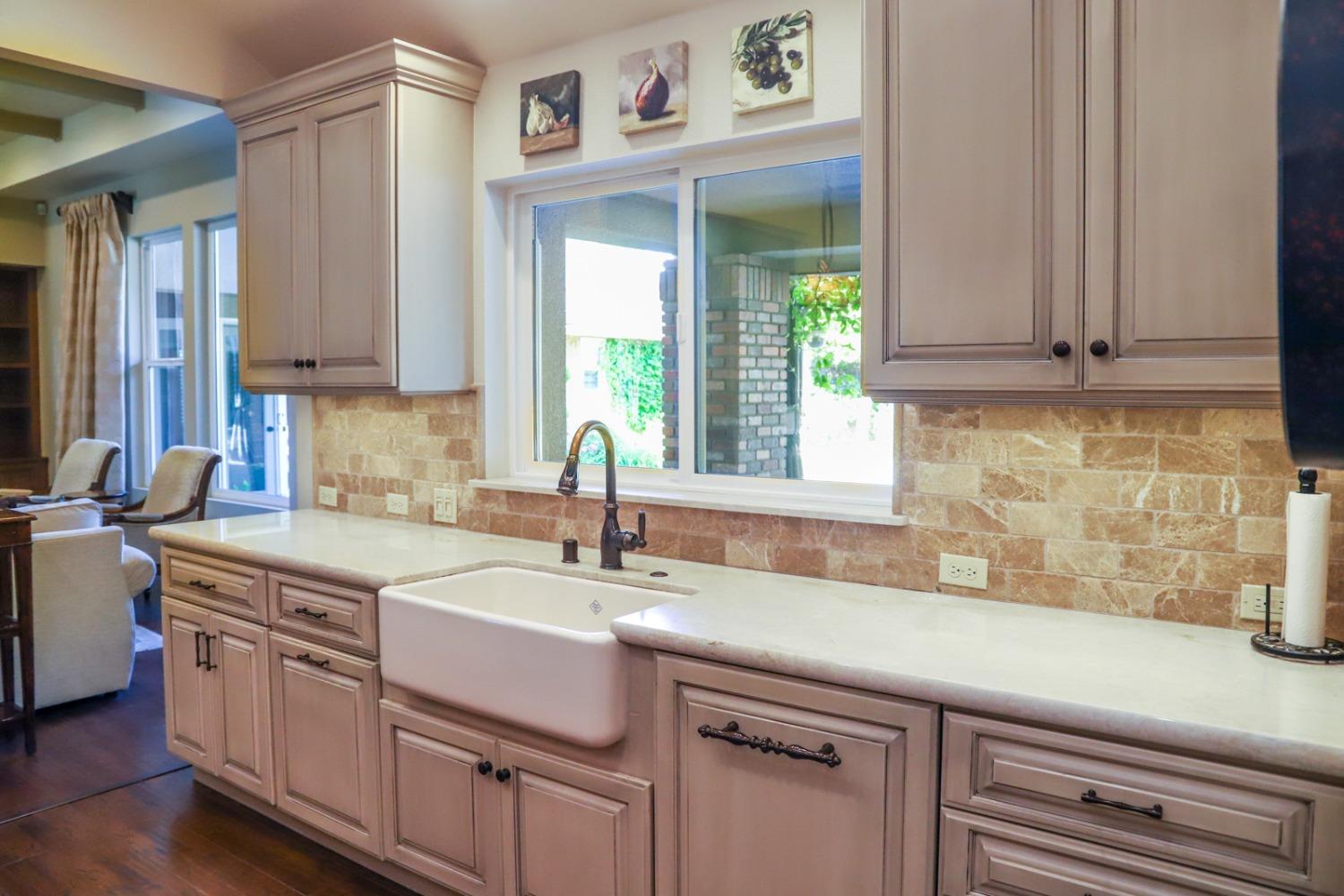7322 North Geraldine Avenue Fresno, CA 93711 - Photo 9 of 36 a kitchen with a sink cabinets and window