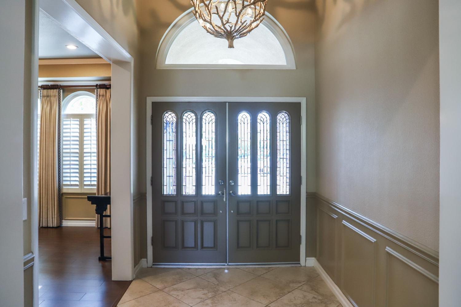 7322 North Geraldine Avenue Fresno, CA 93711 - Photo 10 of 36 a view of a room with wooden floor and windows