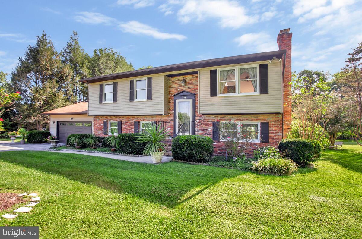 674 Teton Drive Lothian, MD 20711 - Photo 1 of 38 a front view of a house with a yard