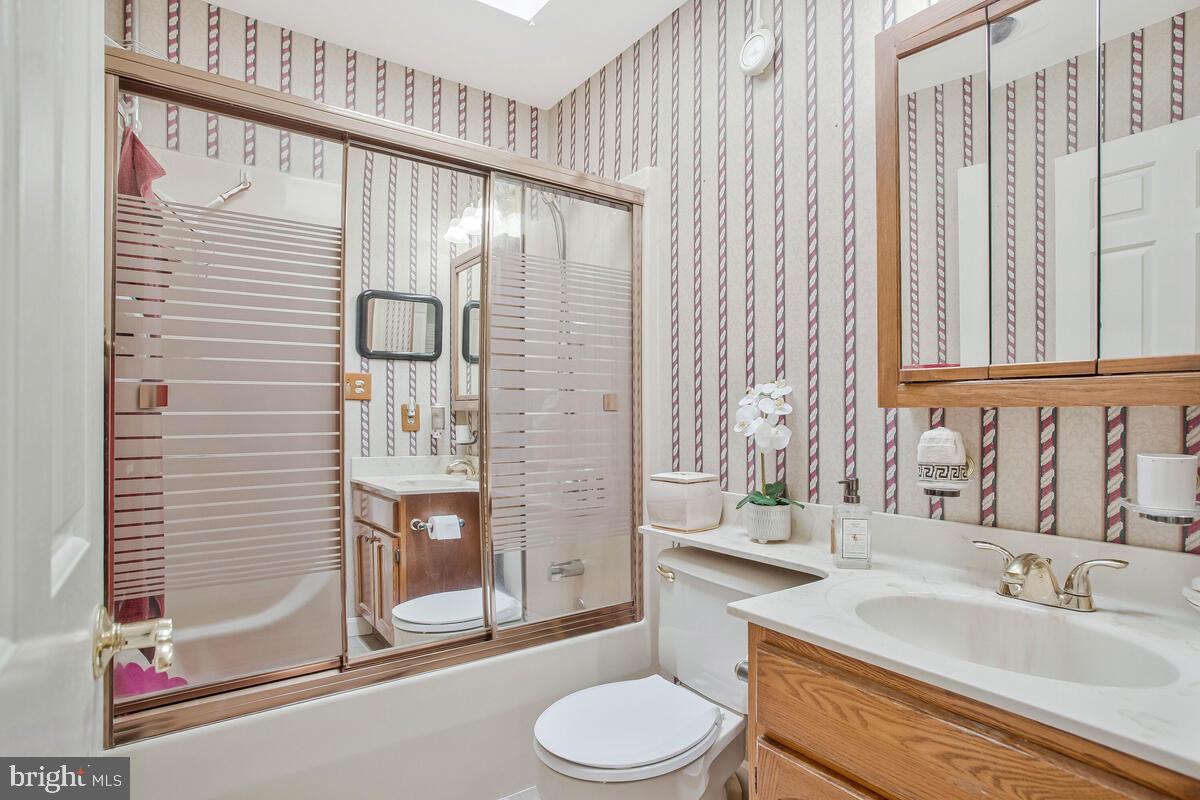 674 Teton Drive Lothian, MD 20711 - Photo 15 of 38 a bathroom with a sink toilet and shower