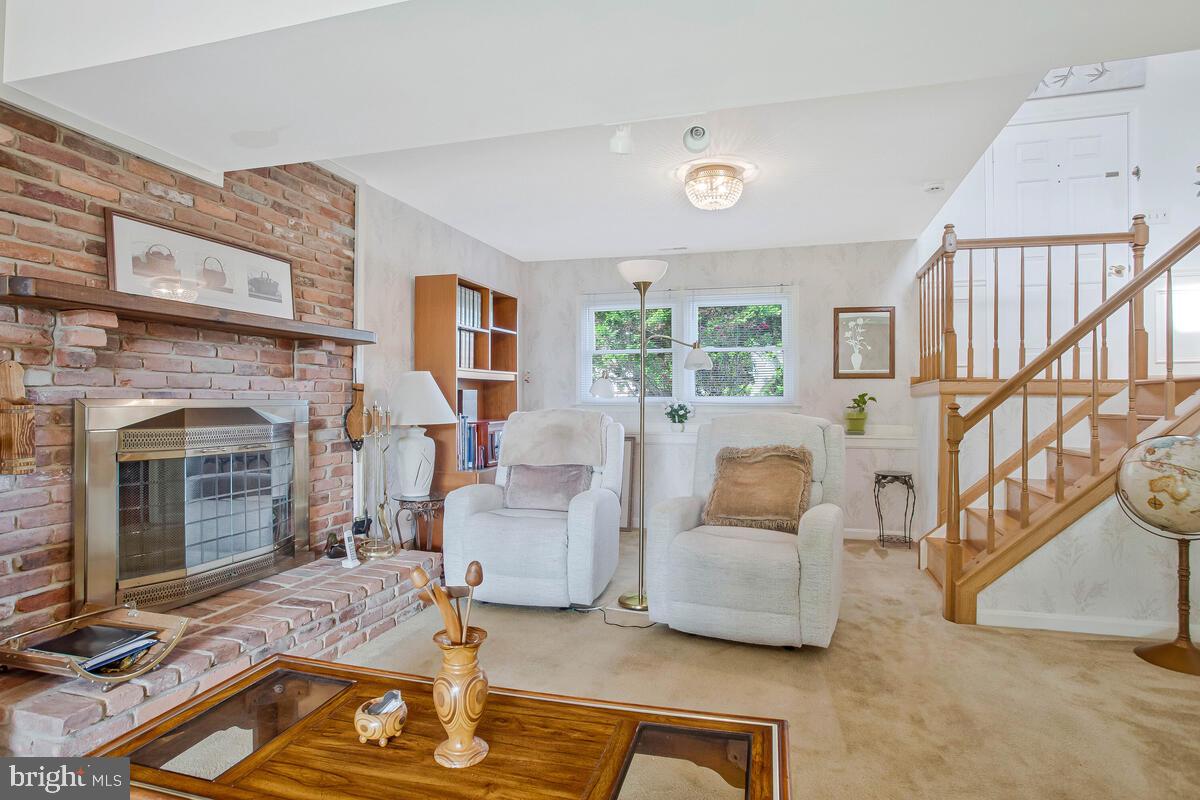 674 Teton Drive Lothian, MD 20711 - Photo 23 of 38 a living room with furniture and a fireplace