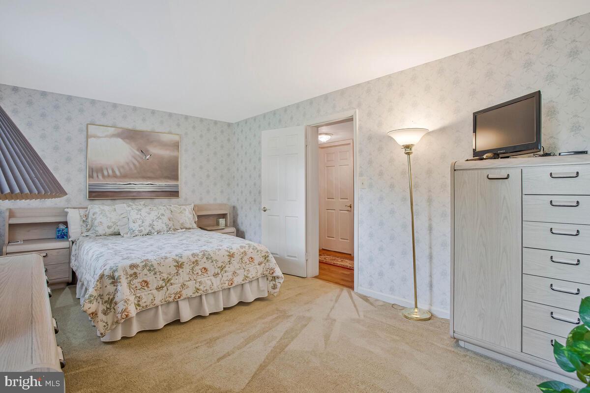 674 Teton Drive Lothian, MD 20711 - Photo 27 of 38 a bedroom with a bed and a flat tv screen in it