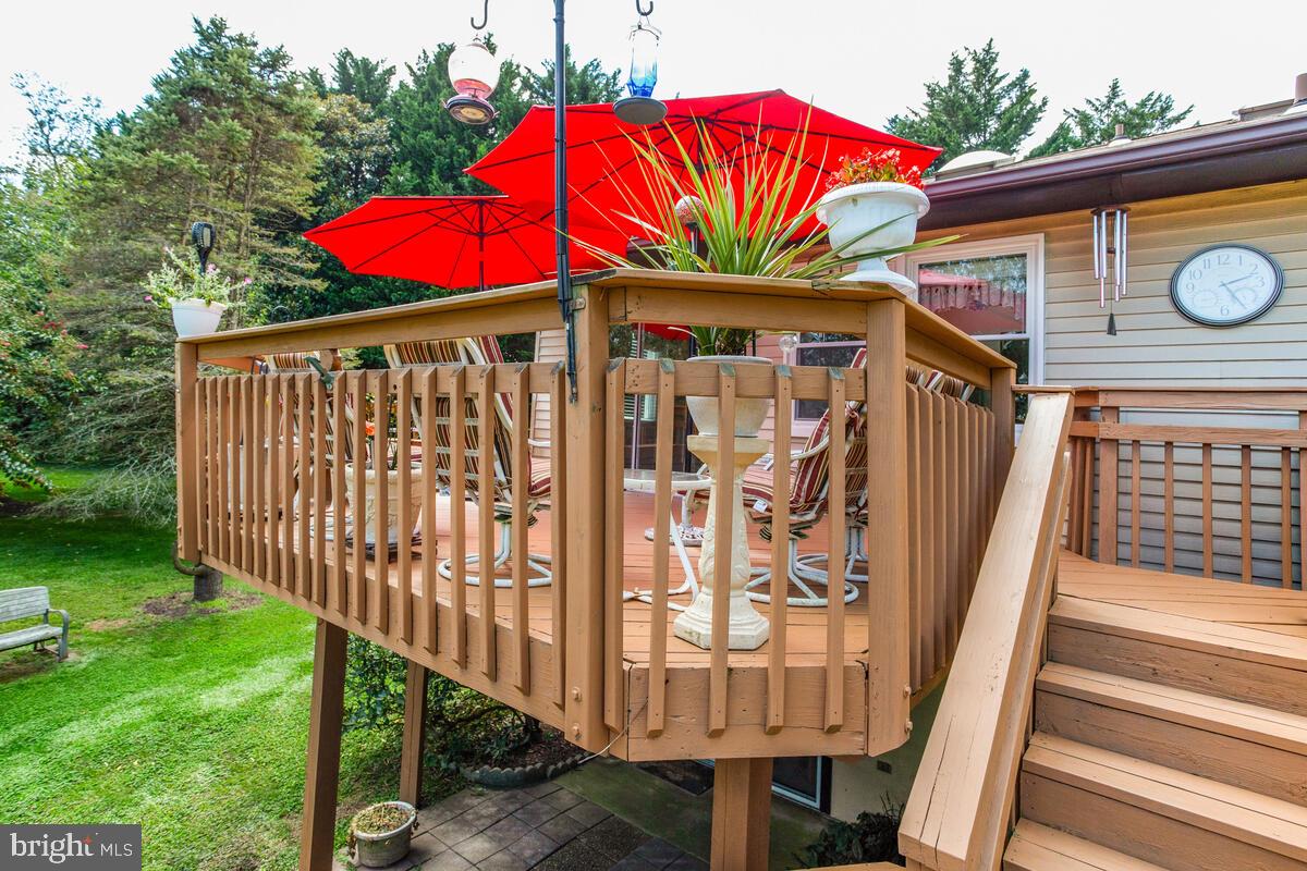 674 Teton Drive Lothian, MD 20711 - Photo 30 of 38 a view of a house with backyard porch and wooden floor