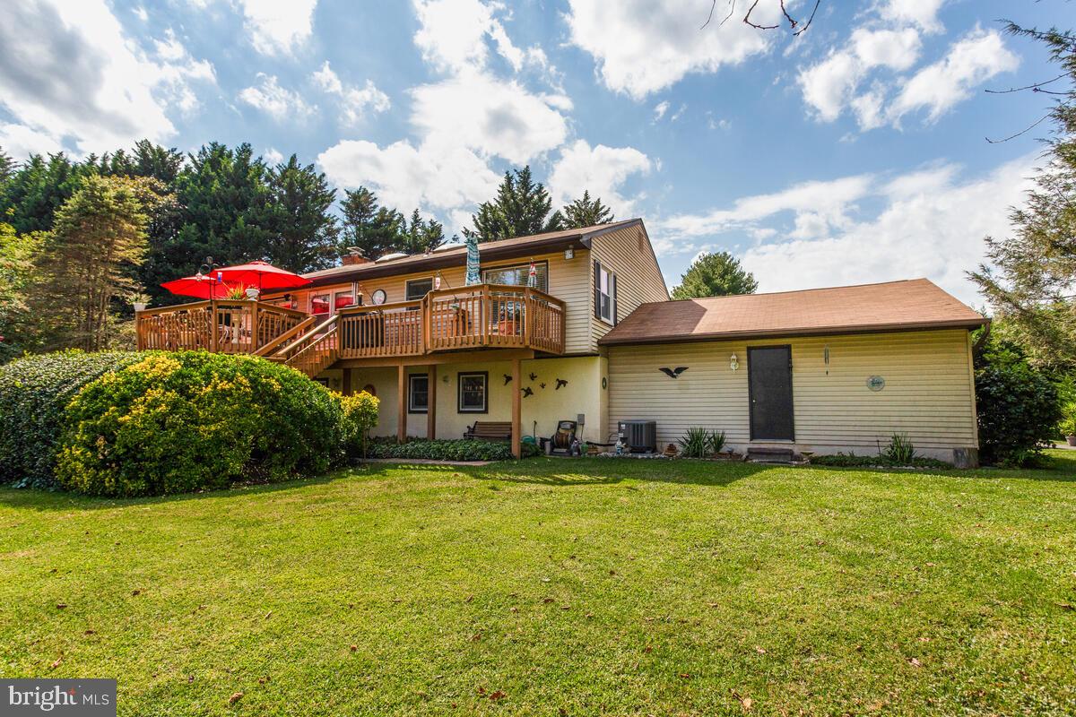 674 Teton Drive Lothian, MD 20711 - Photo 33 of 38 a view of a house with a yard