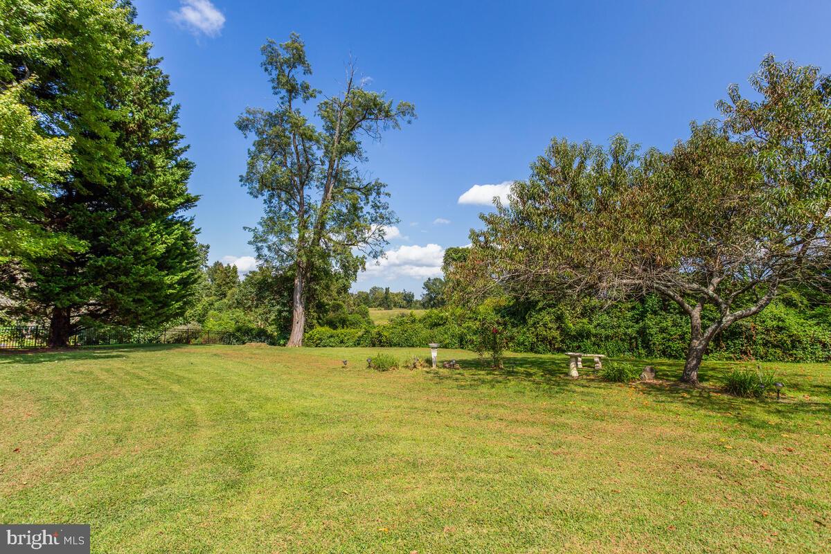 674 Teton Drive Lothian, MD 20711 - Photo 36 of 38 a view of swimming pool with an outdoor space and seating area
