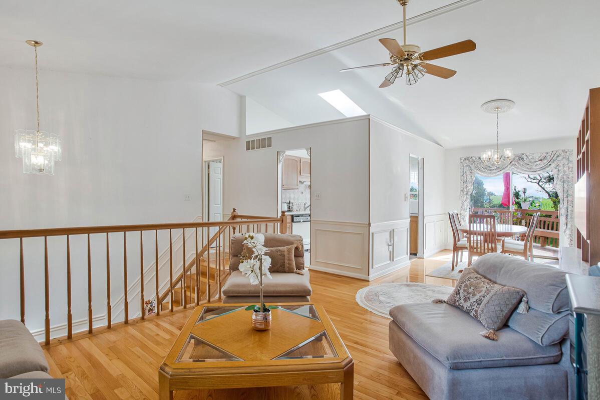 674 Teton Drive Lothian, MD 20711 - Photo 5 of 38 a living room with furniture and a chandelier