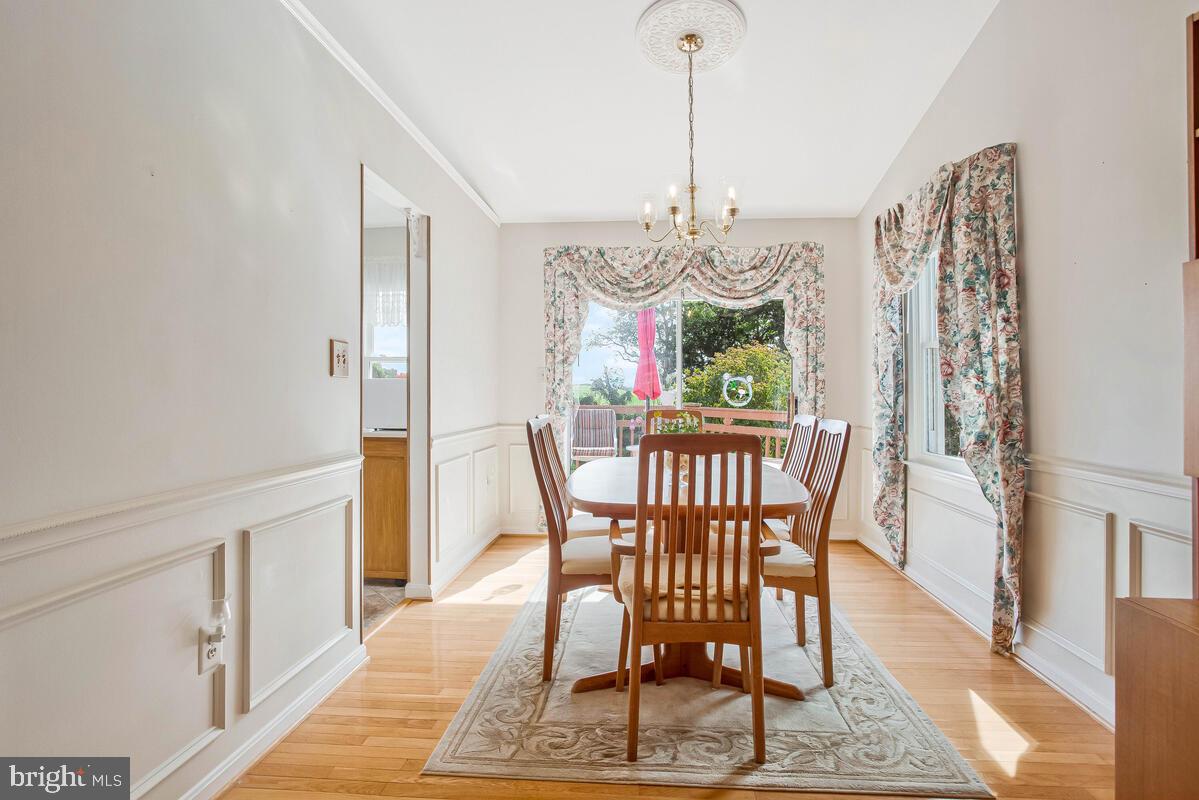 674 Teton Drive Lothian, MD 20711 - Photo 7 of 38 a view of a dining room with furniture window and wooden floor