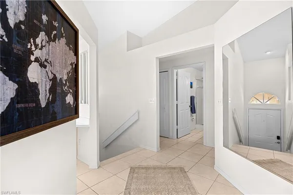 a view of a hallway to rooms