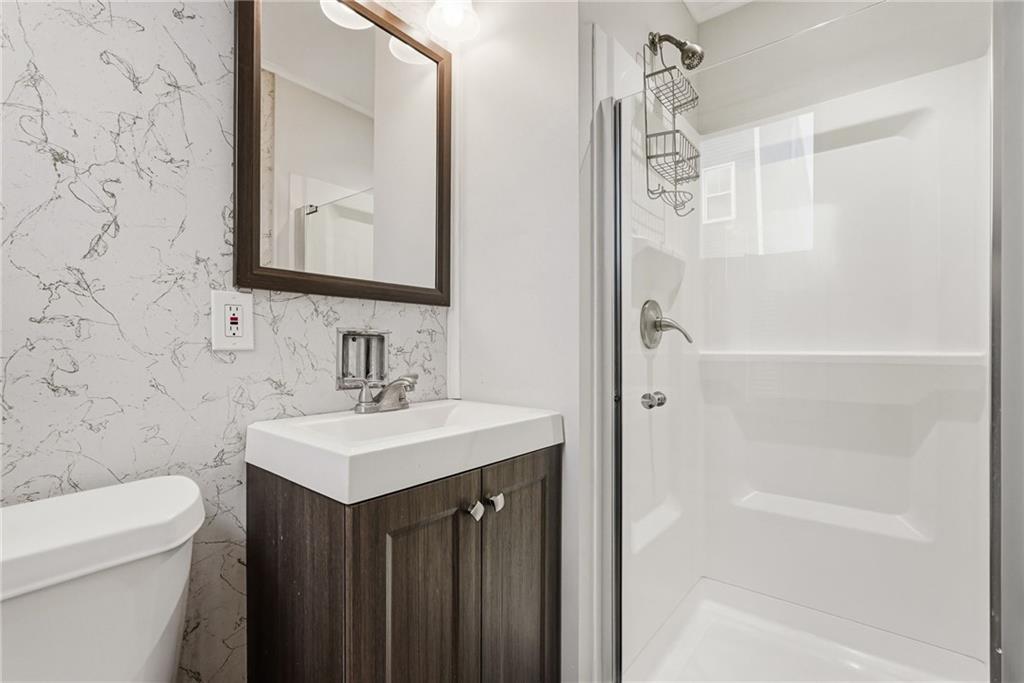 3468 Ligonier Street Pittsburgh, PA 15201 - Photo 20 of 33 a bathroom with a sink a toilet and shower