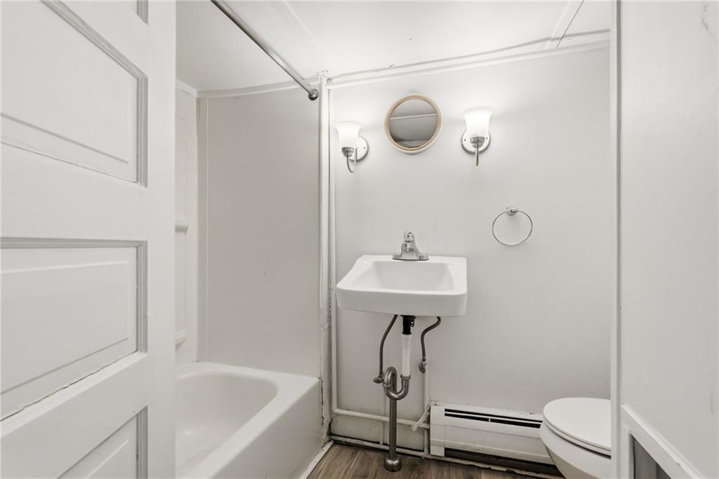 3468 Ligonier Street Pittsburgh, PA 15201 - Photo 24 of 33 a bathroom with a sink toilet and shower