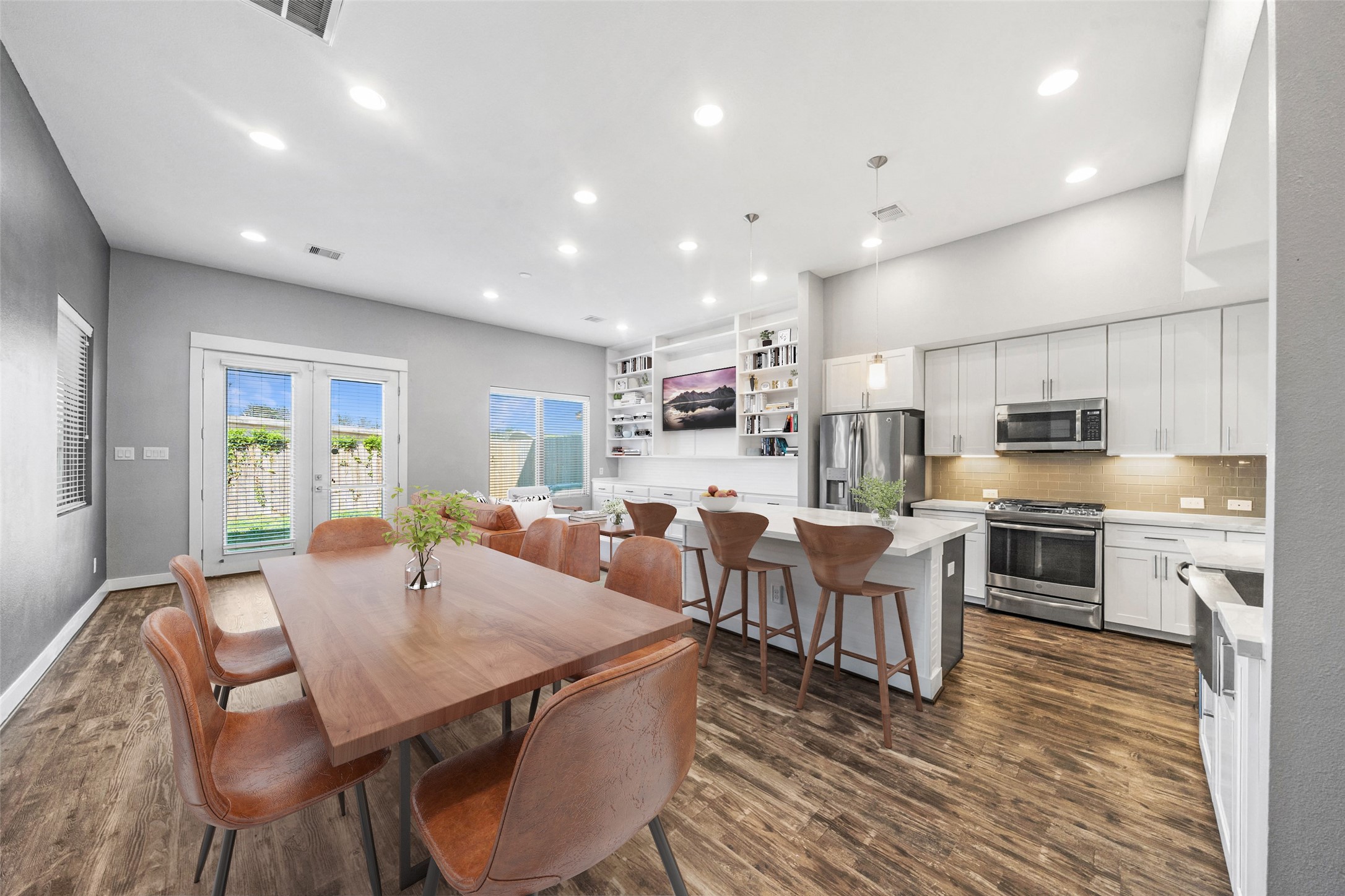 1707 Freeman Street Houston, TX 77009 - Photo 1 of 20 a living room with stainless steel appliances furniture a dining table and kitchen view