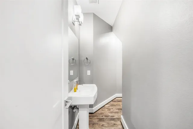 a bathroom with a sink and mirror