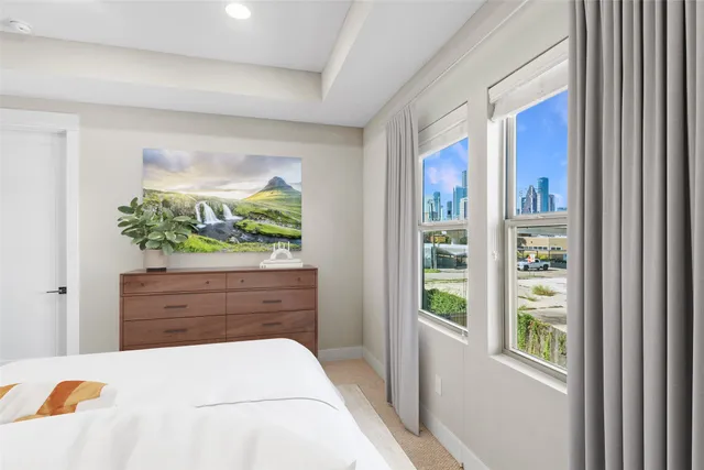 a bed room with a bed and a window