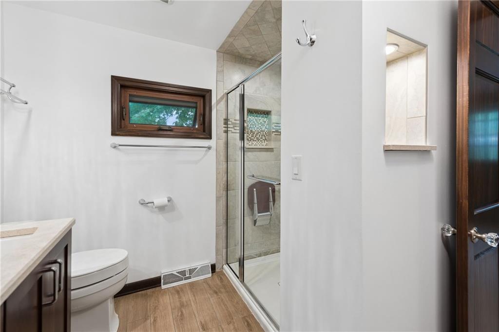 22 Buzzardtown Road Irwin, PA 15642 - Photo 21 of 44 a bathroom with a toilet sink and shower