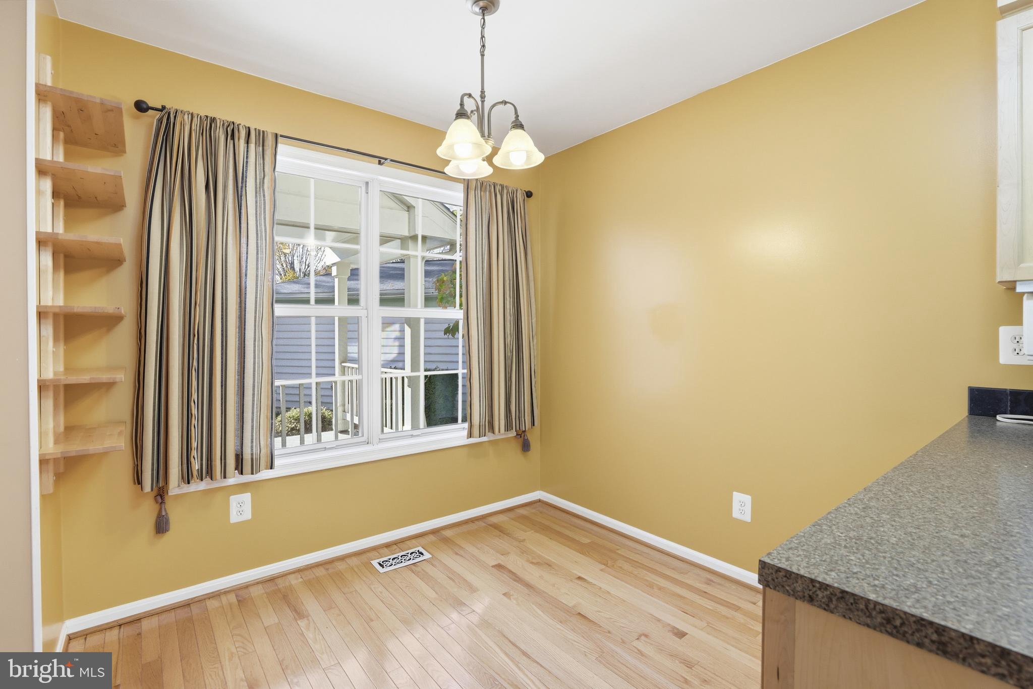 8341 Marketree Circle Montgomery Village, MD 20886 - Photo 12 of 43 a view of a room with a window and wooden floor