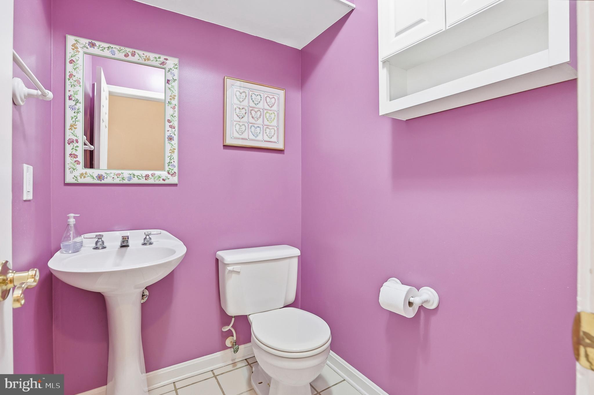 8341 Marketree Circle Montgomery Village, MD 20886 - Photo 18 of 43 a bathroom with a sink mirror and toilet