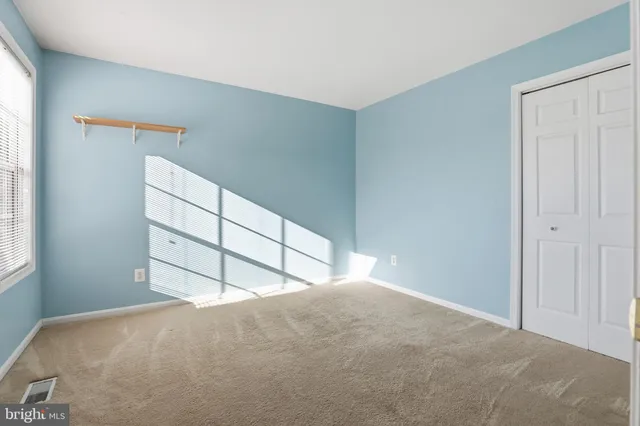 a view of empty room with windows