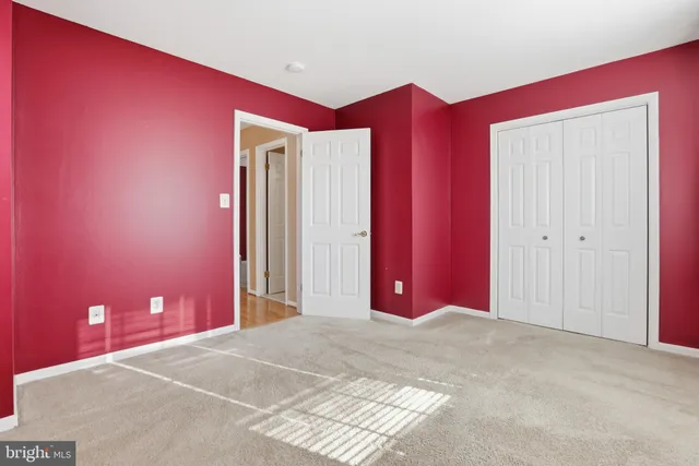 a view of a livingroom with wooden floor and windows