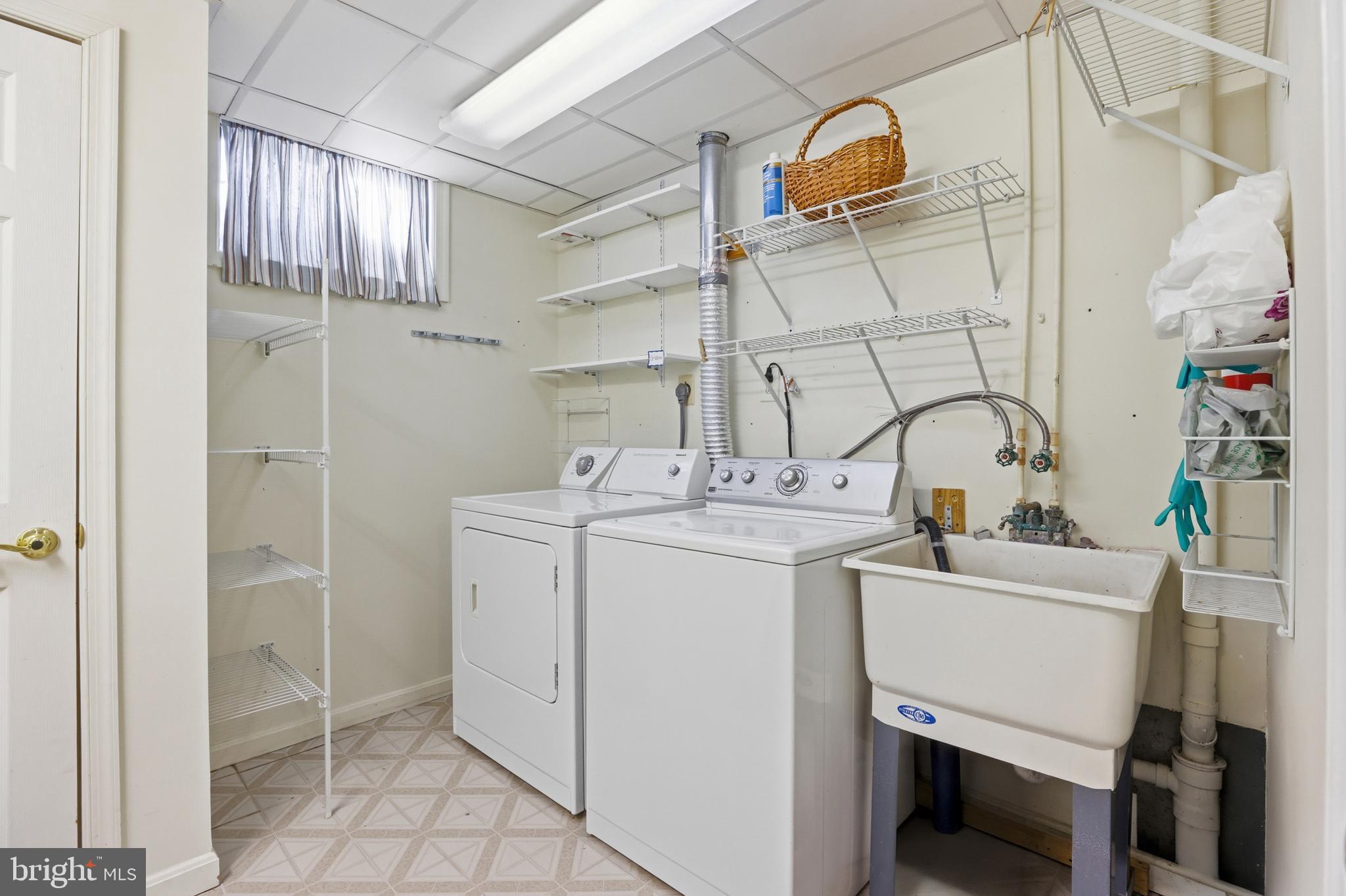 8341 Marketree Circle Montgomery Village, MD 20886 - Photo 38 of 43 a utility room with dryer and washer