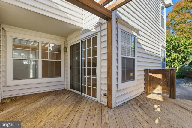 a view of front door and deck of the house
